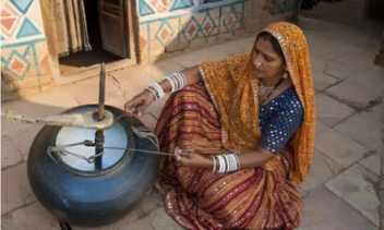 Wooden bilona hand churning - white makhan rising from Gir cow curd